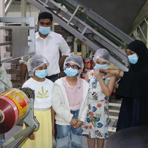 Visitors on a tour of the production floor
